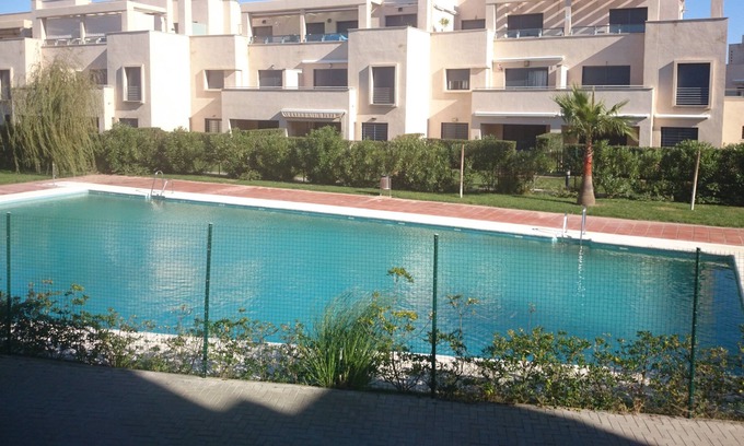 Chipiona Apartment | Ground floor, 1st line beach, own garden, garage, paddle tennis courts, swimming pools.