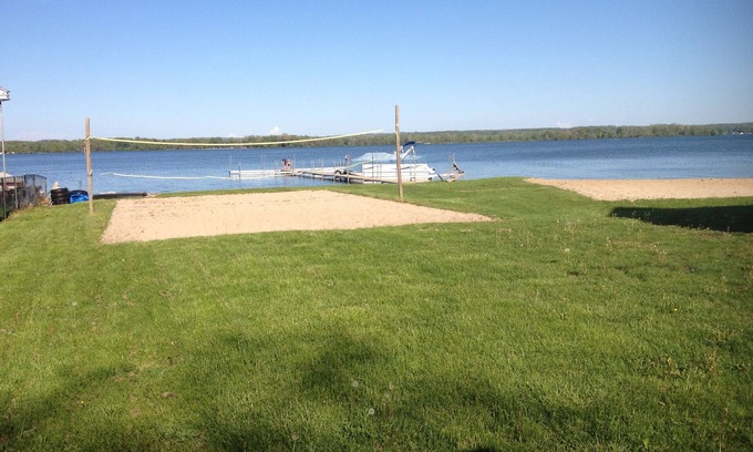 Shelbyville Cottage | Gun Lake Vacation Rental, Sandy beach, docks, picnic tables, kids play grounds
