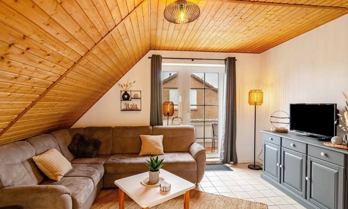 Neßmersiel Apartment | Hübsche Ferienwohnung in Nessmersiel, mit Balkon, Wlan, Haustiere Gestattet.wallbox