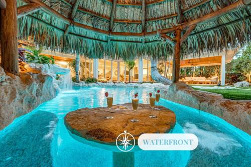 Poinsettia Heights House | Heated pool Lush Tropical Surrounding Castaway Key RESlDENCES