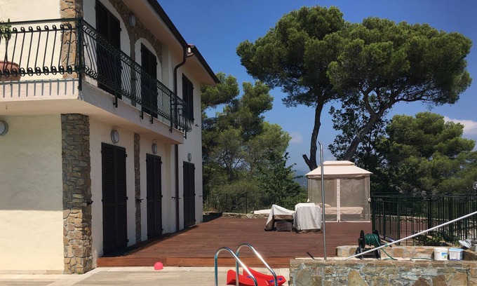 Cipressa Villa | High-end villa w. panoramic views of the Med & the mountains.