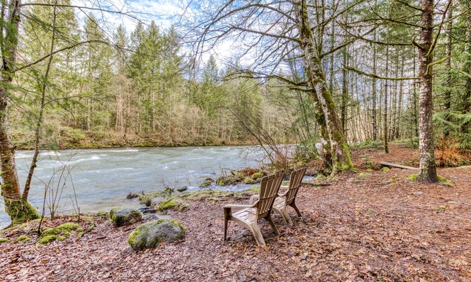 Mount Hood Village Cabin | Historic riverfront Steiner cabin in forest with firepit, deck, & patio lounging