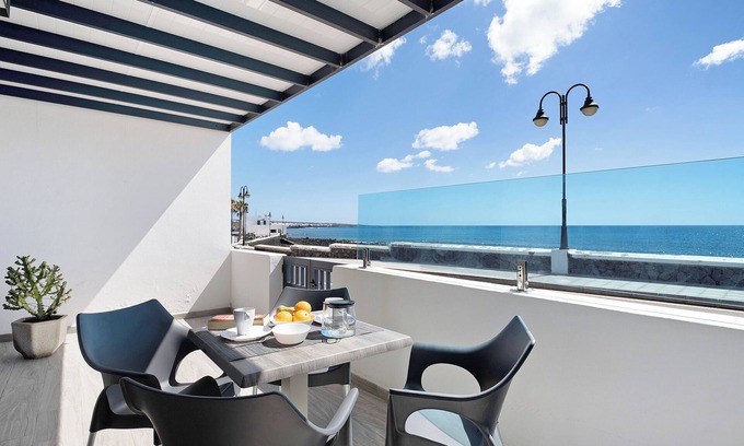 Arrieta Apartment | Holiday Apartment “Callao Beach 3” with Sea View, Terrace & Wi-Fi