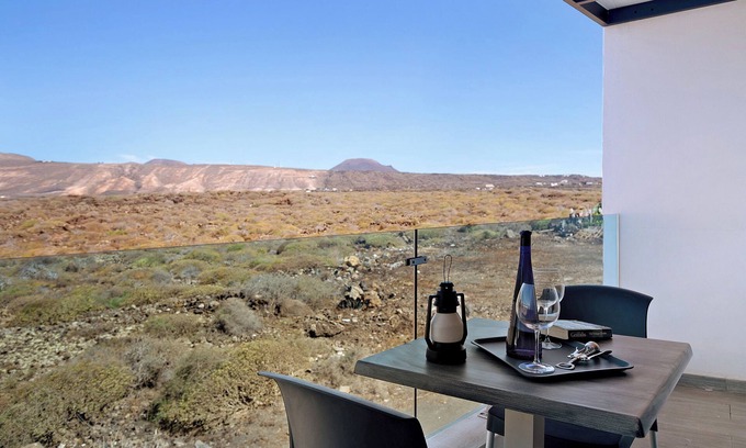 Arrieta Apartment | Holiday Apartment “Callao Beach 10” with Mountain View, Terrace & Wi-Fi