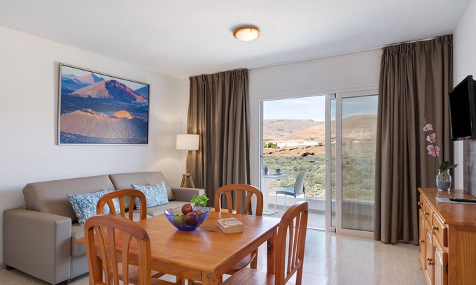 Arrieta Apartment | Holiday Apartment “Callao Beach 9” with Mountain View, Terrace & Wi-Fi