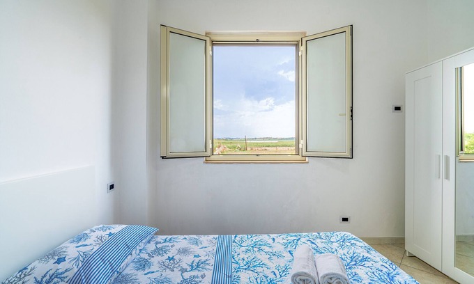 Granelli Apartment | Holiday Apartment "La Nassa" with Sea View, Private Terrace & Shared Garden