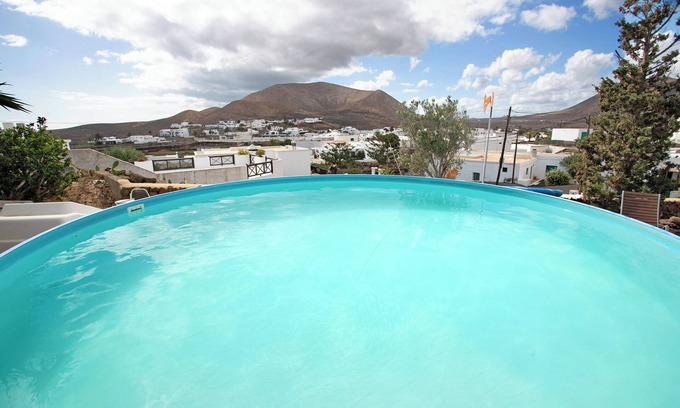 Guatiza House | Holiday Home Casa Consultorio with Mountain View, Pool, Wi-Fi & Terrace