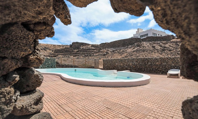 Haria Villa | Holiday Villa 'Playa Marina Eco Bungalow Mala' with Sea Views, Shared Pool and Wi-Fi