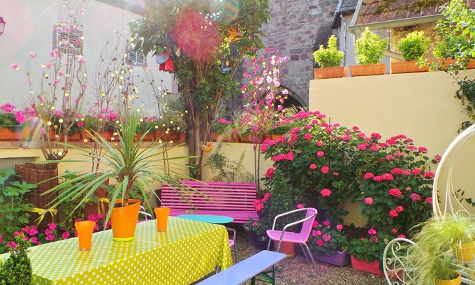 Ribeauville House | Home and garden in vibrant colored frame ready villagers living