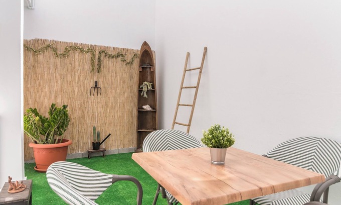 Vecindario Apartment | Home2Book Bright Retreat with Patio & Roof Access