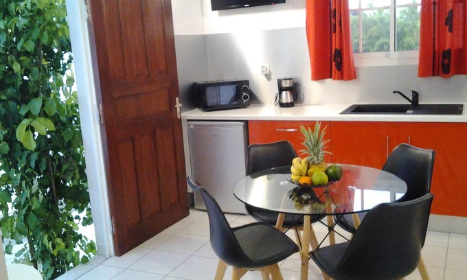 Damencourt House | Homerez - House for 2 pers. with shared pool, garden and balcony in Le Moule