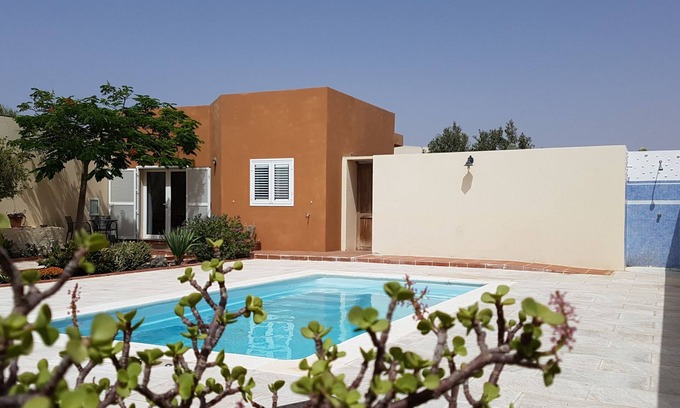 Antigua House | House with pool between gardens and olive farm.