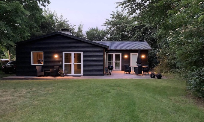 Rageleje House | In the charming coastal town of Rågeleje, this lovely holiday home is located.