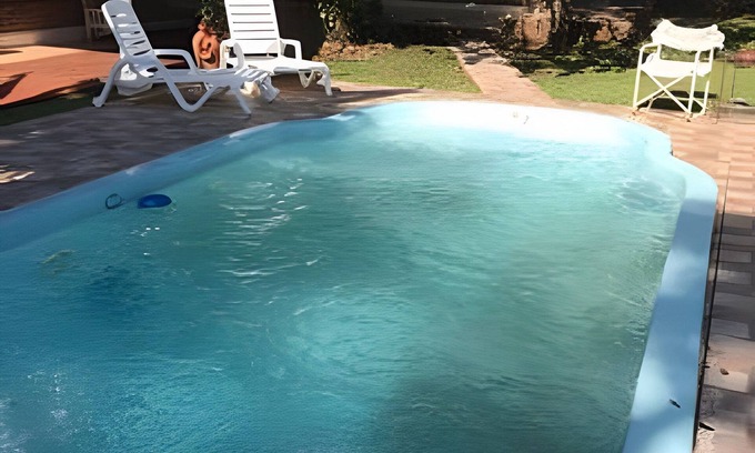 Obera Condo | KatyArte cabins with a pool entering Oberá