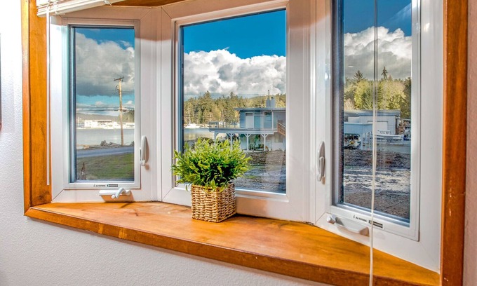 Oak Harbor Cottage | Kick Back & Watch the Day Cruise By at Cornet Bay