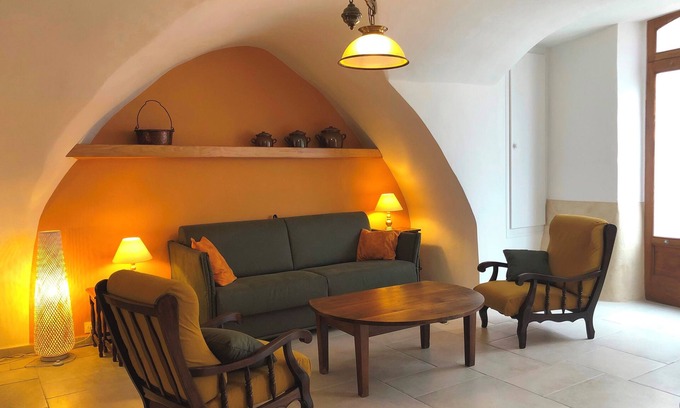 Montpeyroux House | "la maison de Marie" 17th century village house stone arches courtyard + terrace