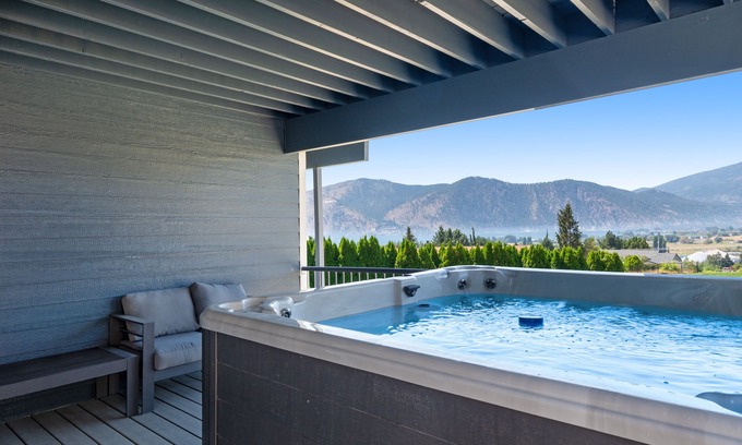 Manson House | Lake & mountain view home with hot tub, pool, 2 decks, game room, & fireplace