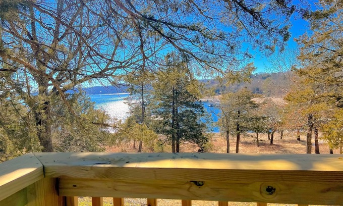 Lost Bridge Village House | Lakefront charmer with game room, decks, & excellent fishing - near rec center