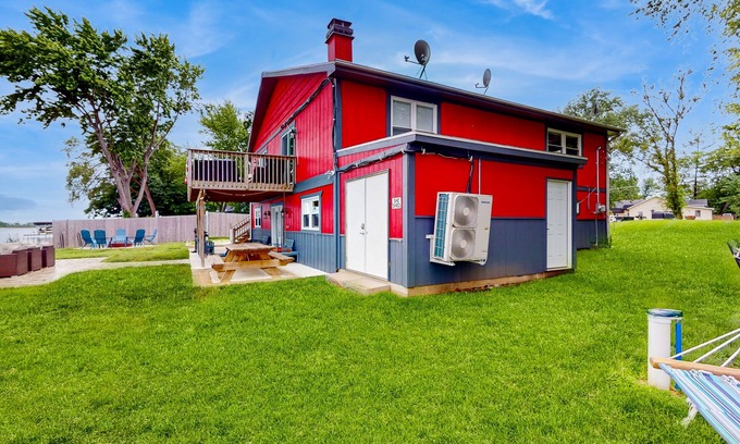 Channel Lake House | Lakefront home with firepit, 2 kitchens, & 2 W/Ds