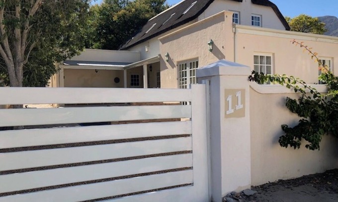 Franschhoek House | Large guest room ensuite, 40 square meters, Flat TV, Fridge , roof fan.