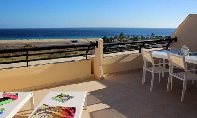 Morro Jable Apartment | Large sun terrace with a view over the beach of Jandia