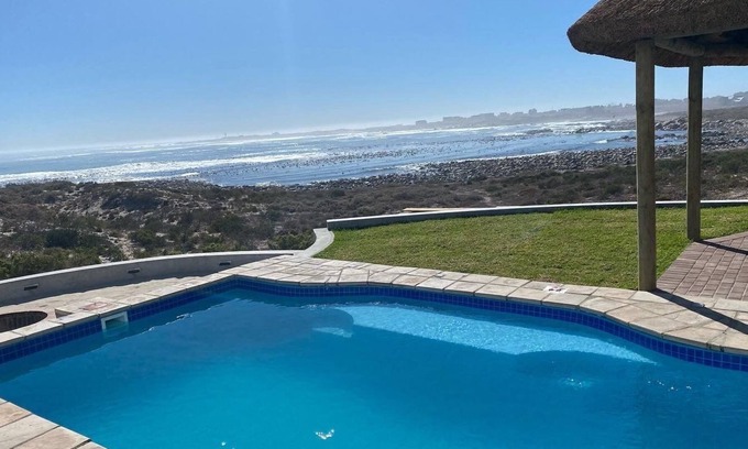 St. Helena Bay Villa | Large villa with warm pool on the beach