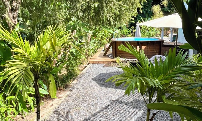 Cafeiere Cottage | Les Vanilles Gite in lush tropical setting, swimming pool 800m from the beach.