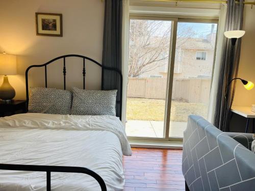 Southwest Calgary House | Lily room near golf and banff costco newly renovated queen size bed Single bathroom sofa TV