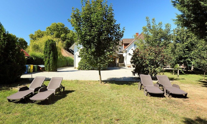 Balatonszemes Apartment | Lovely apartment for 15 people with WIFI, A/C, TV, patio, pets allowed and parking
