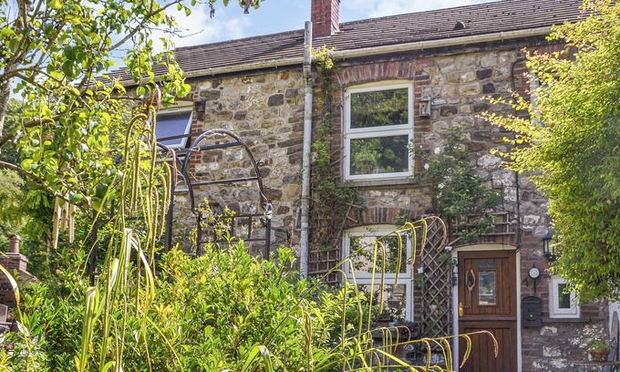 Margam Cottage | Lovely cottage with a large garden and decked area overlooking the River Taff.