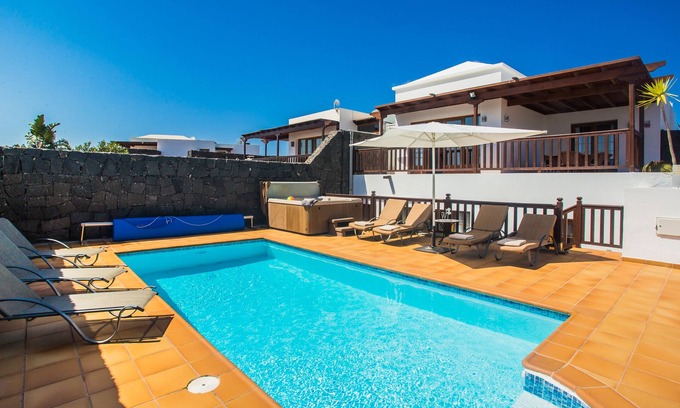 Playa Blanca Villa | Lovely spacious villa with heated pool, jacuzzi, sea/mountain views, full aircon