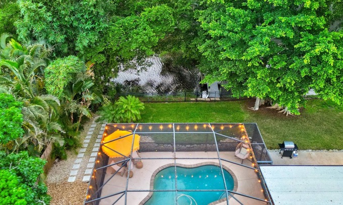 Palma Sola House | Luxurious Pool on the Lakefront w/Private Dock