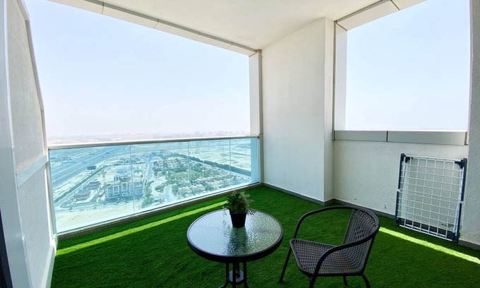 Jumeirah Village Triangle Apartment | Marco Polo - Pastel Studio with Stunning Aerial City Views