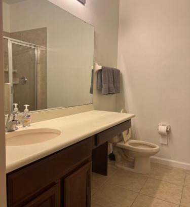 Southeast Orlando House | Master bedroom next to the airport