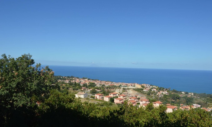 Santa Domenica Apartment | Modern apartment with communal pool surrounded by a beautiful garden