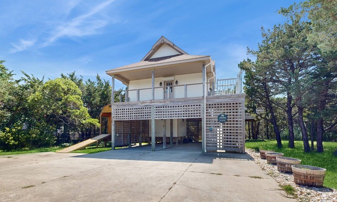 Avon House | Modern Avon retreat with beach access, community pool, and stunning water views