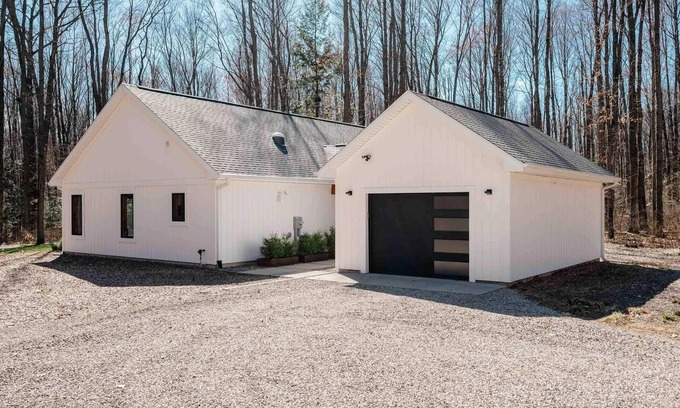 Interlochen House | Modern, custom home with 42-jet Jacuzzi in peaceful, private, wooded enclave