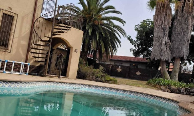 Greater Johannesburg Metropolitan Area Bed & Breakfast | Modern guest house where guests can enjoy its outdoor pool, kids gym and garden.