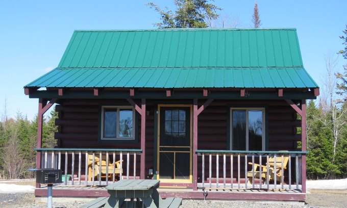 East Corinth Cabin | Modern log cabin with pond view available for rent in middle Maine.