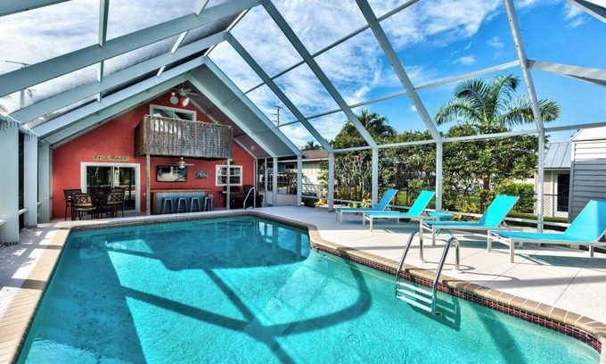 East Naples House | Naples Beach Escape | Pool, Canal Views & Tiki Vibes Near Pier & 5th Avenue