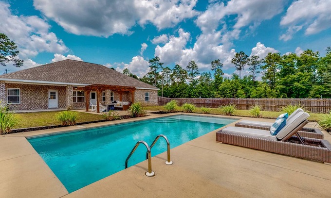 Crestview House | Nautical-themed retreat with a saltwater pool, fire table, full kitchen, and AC