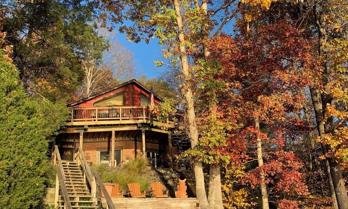 Livingston House | "No Wake Zone" with large dock, covered slip, and diving platform.