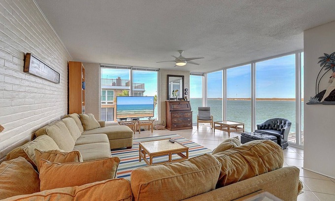 Port Aransas Condo | Panoramic views of the ship channel & private fishing pier from living room!