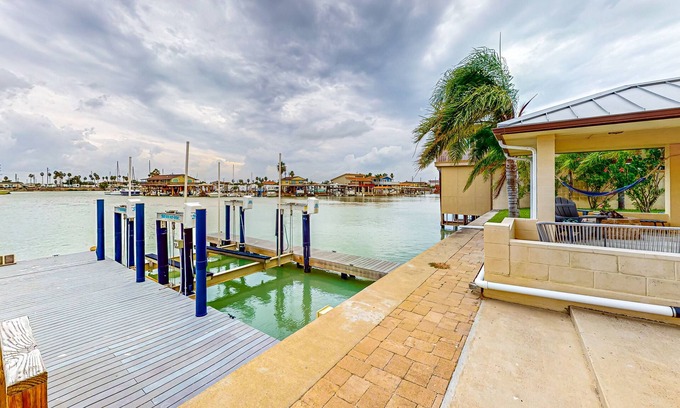 Port Isabel House | Perfectly located waterfront getaway with patio, grill, AC, & gorgeous bay views
