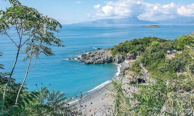 Praia a Mare Apartment | Practical apartment with open terrace and communal pool.