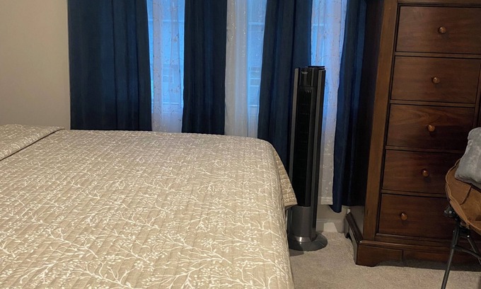 Milford House | Primary bedroom and private bathroom space. Shared kitchen and dining area