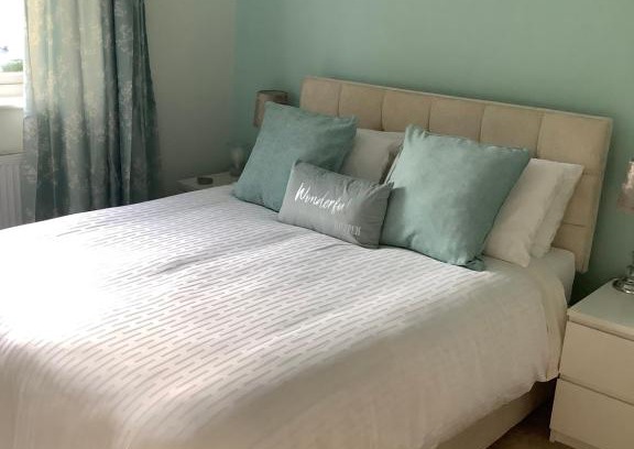 Bournemouth House | Private room, shared bathroom with one other, tea and coffee making facilities, mini fridge and hairdryer, King sized bed with help yourself continental breakfast in Secluded Modern Property with Parking
