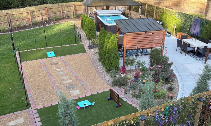 Waldron House | Private Urban Oasis with heated pool spa, outdoor bar and TV, firepit, corn hole