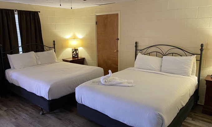 Mount Ida Apartment | Queen Guest Room located at the Joplin Inn at the entrance to Mountain Harbor, just 2 1/2 miles from Lake Ouachita. by RedAwning