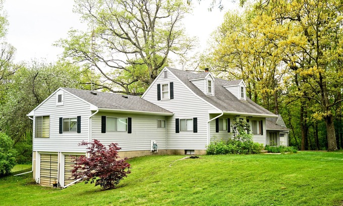 East Lansing House | Quiet 5 bedroom house on 3 acres plus woods, 5 min from MSU campus, easy access.
